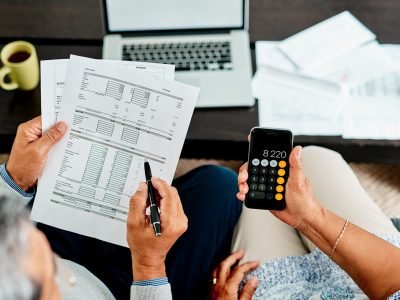 We need to make all our numbers balance High angle shot of a couple calculating their finances together at home